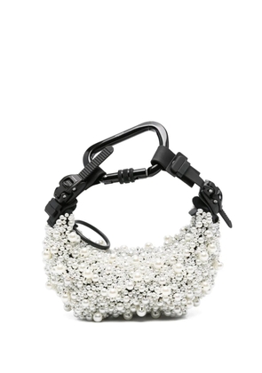 Innerraum pearl-embellished carabiner clutch bag - White