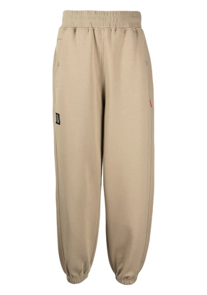 izzue Label logo-patch cotton blend track pants - Brown