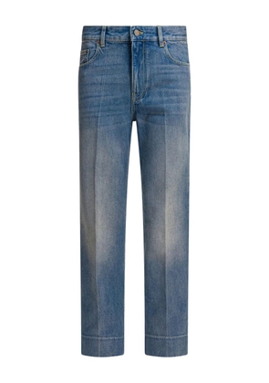 Valentino Garavani logo-patch cuffed denim jeans - Blue