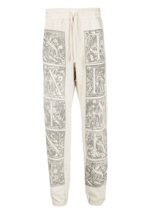 SAINT MXXXXXX graphic-print cotton track pants - Neutrals
