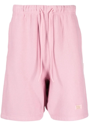 Advisory Board Crystals logo-embroidered cotton track shorts - Pink