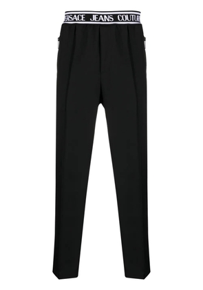 Versace Jeans Couture logo-waistband slim-cut trousers - Black