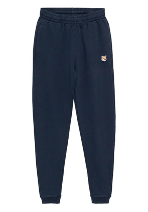 Maison Kitsuné fox-head-patched track pants - Blue