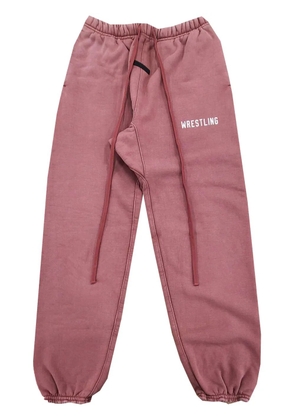 FEAR OF GOD ESSENTIALS slogan-print track pants - Pink
