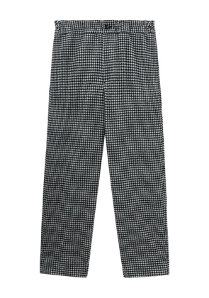 Black Comme Des Garçons houndstooth-pattern trousers