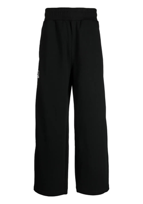 izzue logo-appliqué wide-leg trousers - Black