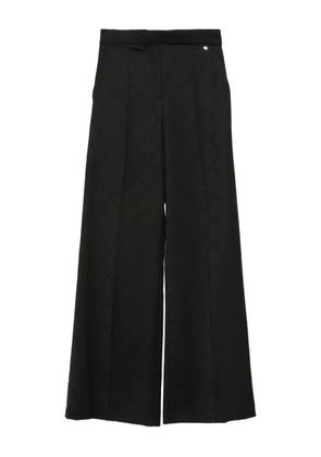 NISSA pressed-pleat geometric-pattern trousers - Black