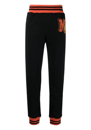 Moschino logo patch track pants - Black