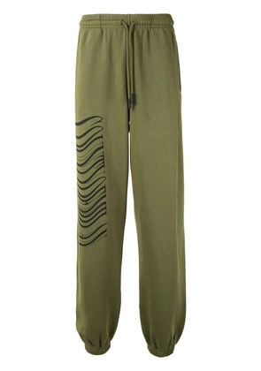COUNTY OF MILAN logo print track pants - Green