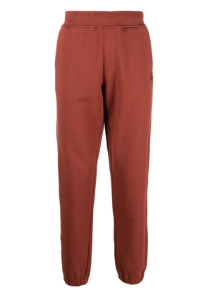 C.P. Company logo-embroidered cotton track pants - Orange