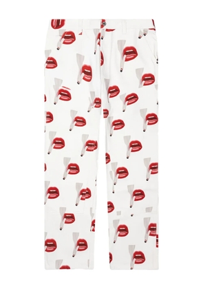 Emotionally Unavailable x Tom Wesselmann smoking lips-print trousers - White