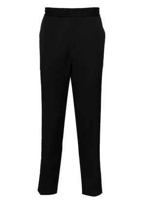 Golden Goose logo-plaque virgin wool trousers - Black