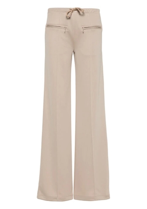 Courrèges logo-patch ribbed trousers - Neutrals