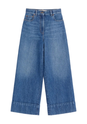 Valentino Garavani cuffed v-motif cropped jeans - Blue