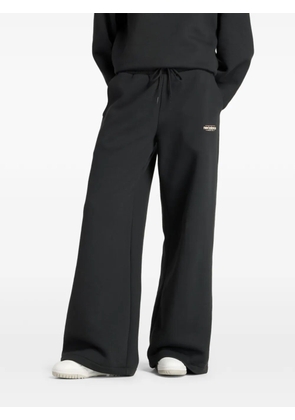 New Balance logo-print track pants - Black