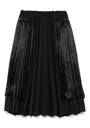 Black Comme Des Garçons pleated midi skirt