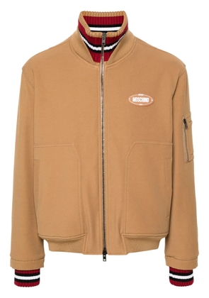 Moschino logo-appliqué twill bomber jacket - Brown