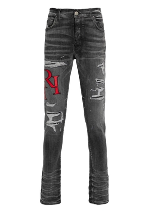 AMIRI distressed skinny jeans - Black