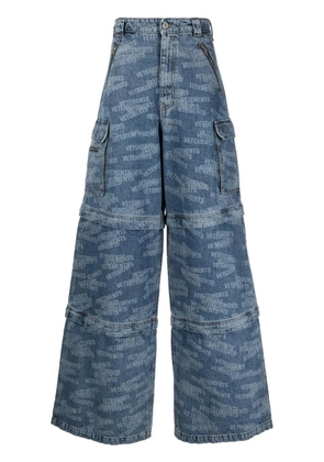 VETEMENTS Transformer logo-print jeans - Blue