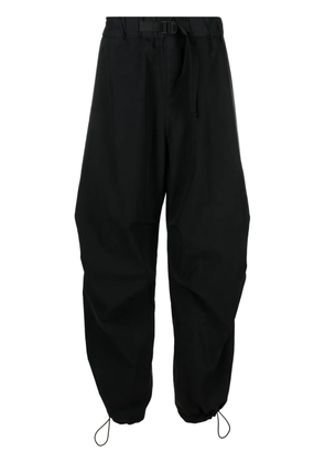 Studio Nicholson Caro belted wide-leg trousers - Black