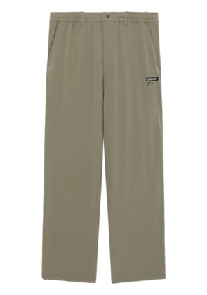 izzue logo-appliquéd trousers - Green