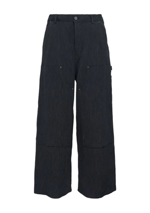 Taakk crepe-texture trousers - Black