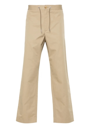 Moncler logo-appliqué tapered trousers - Neutrals