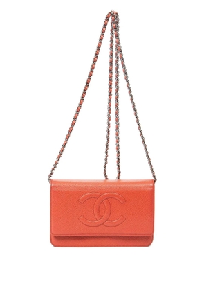 CHANEL Pre-Owned embossed-CC crossbody bag - Red