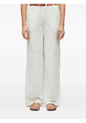 Osklen floral-jacquard trousers - White