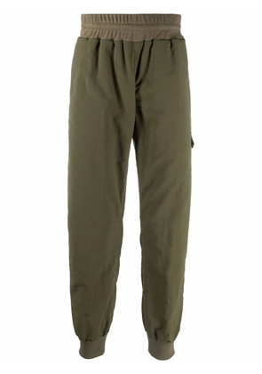 Undercover cropped track pants - Green
