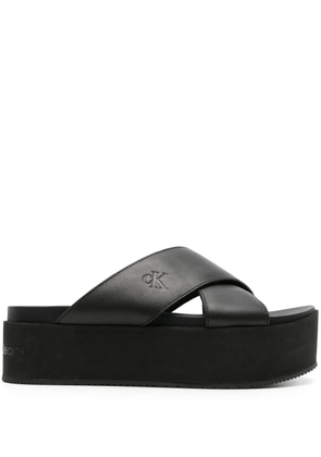 Calvin Klein Jeans logo-debossed flatform slides - Black