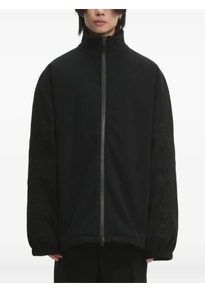 VETEMENTS logo-embossed zip-up jacket - Black