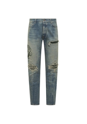 AMIRI embroidered distressed-effect jeans - Blue