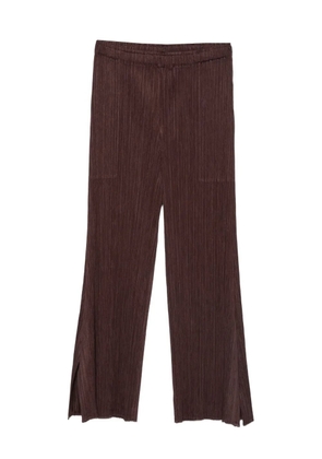 Pleats Please Issey Miyake plissé split-hem trousers - Brown