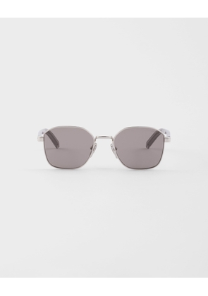 Sunglasses with the iconic metal plaque