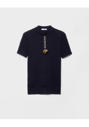 Short-sleeved wool sweater with pendant