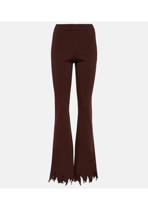 JW Anderson Ribbed-knit distressed slim pants