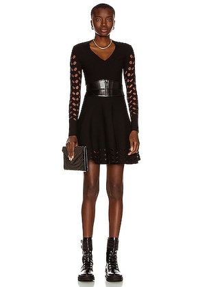 ALAÏA Long Sleeve Mini Dress in Noir - Black. Size 42 (also in ).