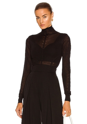 ALAÏA Long Sleeve Roll Neck Sweater in Noir - Black. Size 42 (also in ).