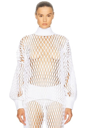 ALAÏA Long Sleeve Turtleneck Top in Blanc - White. Size 40 (also in ).