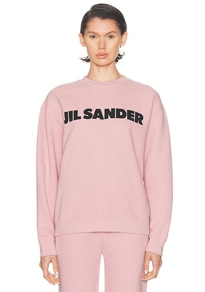 Jil Sander Crew Neck Long Sleeve Sweatshirt in Neon Rose - Pink. Size M (also in XS, S).