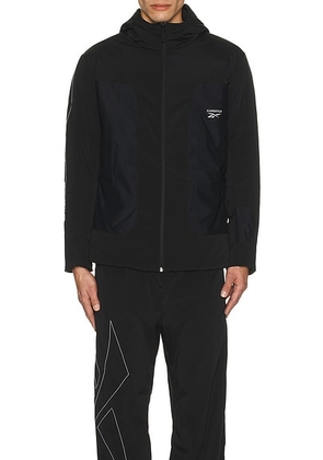 Reebok X Kanghyuk Stitched Logo Padded Jacket in Dark Grey - Black. Size M (also in S, XL).