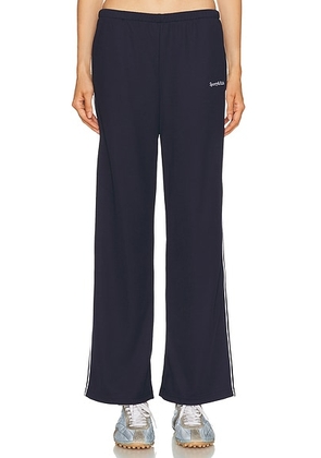 Sporty & Rich Serif Logo Track Pant in Dark Navy & White - Navy. Size M (also in ).