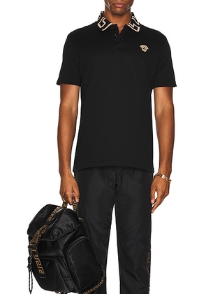 VERSACE Taylor Fit Polo in Black - Black. Size L (also in M, S, XL, XS, XXL).