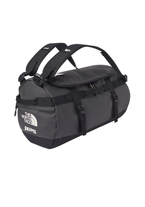 The North Face x SKIMS Small Base Camp Duffel Bag in SK Onyx - Charcoal,Black. Size all.
