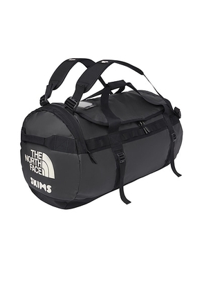 The North Face x SKIMS Large Base Camp Duffel Bag in SK Onyx - Charcoal,Black. Size all.
