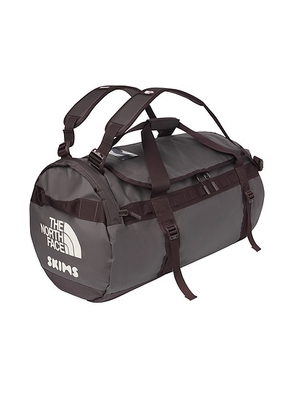 The North Face x SKIMS Large Base Camp Duffel Bag in SK Phoenix - Brown. Size all.