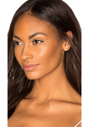 EF COLLECTION Gold Jumbo Huggie Earring in Metallic Gold.