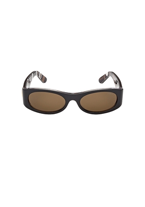 Emilio Pucci Oval Sunglasses in Brown.
