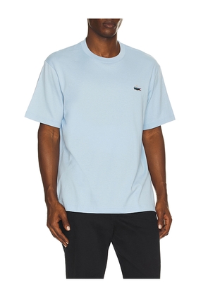 Lacoste Heavy Jersey Landscape Crocodile Print T-shirt in Baby Blue. Size 3. Also in 4, 5, 6, 7.